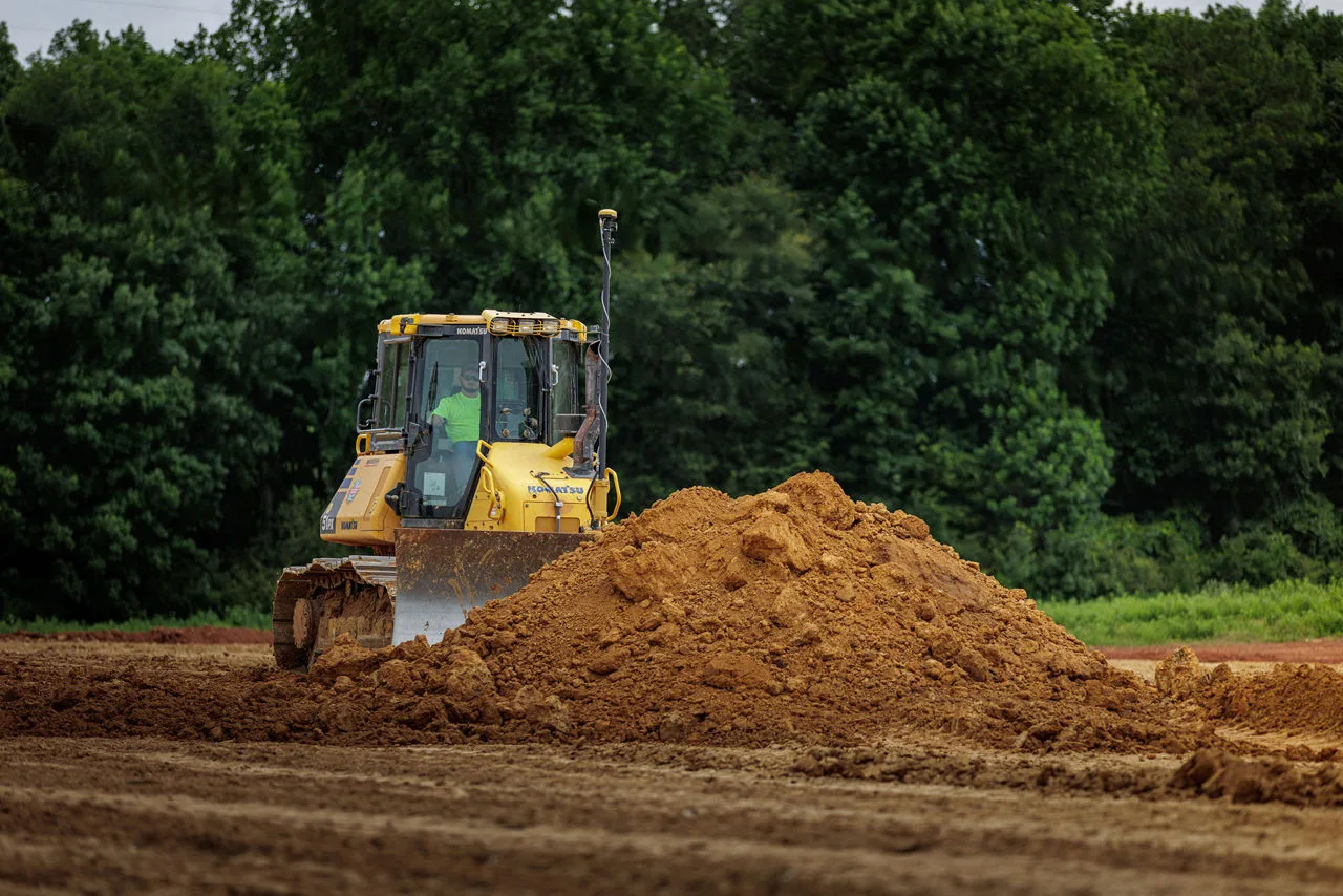 Dozer pushing dirt on a Gulf Coast excavation site